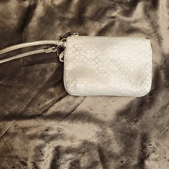 Elegant Coach White and Silver Wristlet